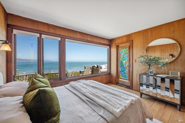 272 Ocean Pkwy, Bolinas, CA 94924 - bedroom featuring wooden walls, a water view, and wood-type flooring