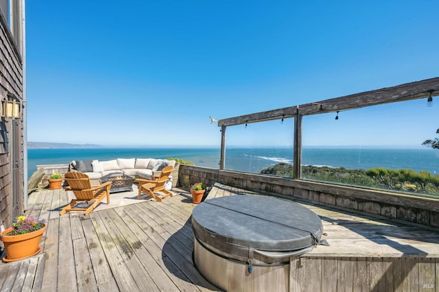 272 Ocean Pkwy, Bolinas, CA 94924 - wooden deck with a fire pit, a hot tub, and a water view