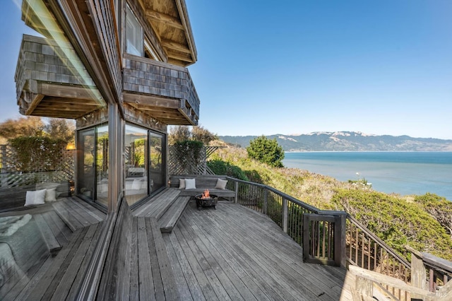 272 Ocean Pkwy, Bolinas, CA 94924 - wooden deck with a fire pit and a water and mountain view