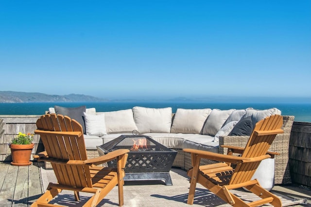 272 Ocean Pkwy, Bolinas, CA 94924 - wooden deck featuring a water view and an outdoor living space with a fire pit