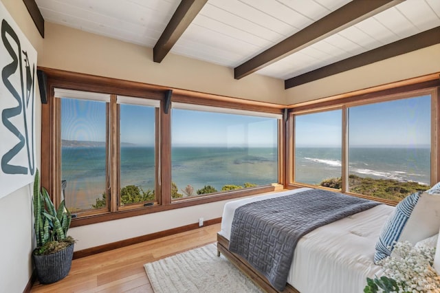 272 Ocean Pkwy, Bolinas, CA 94924 - bedroom featuring wood finished floors, beamed ceiling, and a water view