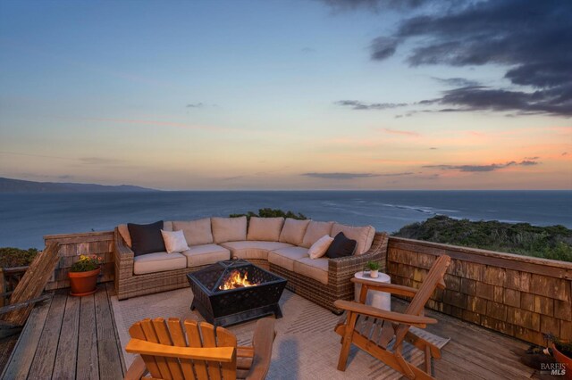 272 Ocean Pkwy, Bolinas, CA 94924 - deck at dusk with an outdoor living space with a fire pit and a water view