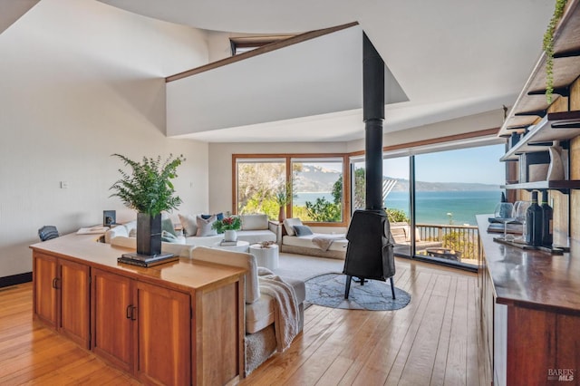 272 Ocean Pkwy, Bolinas, CA 94924 - living area featuring a wood stove, light wood-style floors, and a water view