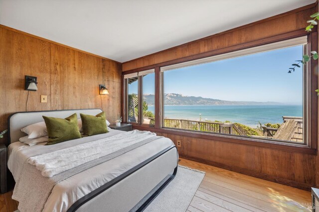 272 Ocean Pkwy, Bolinas, CA 94924 - bedroom featuring wood walls, a water and mountain view, and wood-type flooring