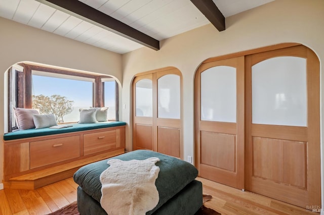 272 Ocean Pkwy, Bolinas, CA 94924 - bedroom with beamed ceiling and light wood-style flooring
