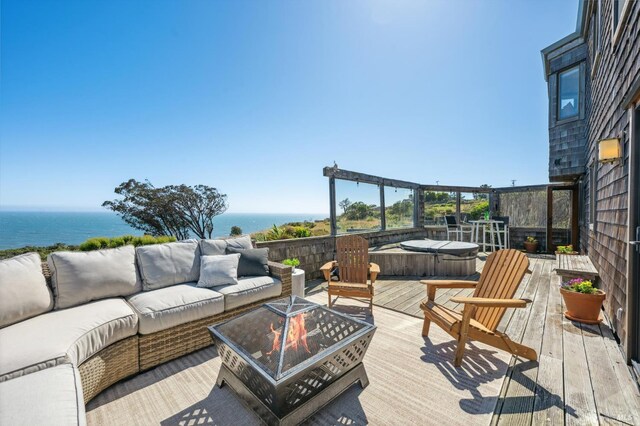 272 Ocean Pkwy, Bolinas, CA 94924 - deck featuring an outdoor living space with a fire pit, a water view, and a covered hot tub