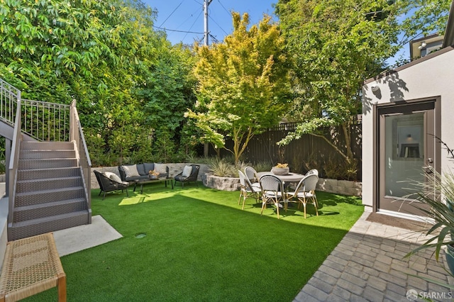 view of yard featuring an outdoor living space and a patio