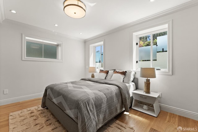 bedroom featuring hardwood / wood-style flooring and ornamental molding