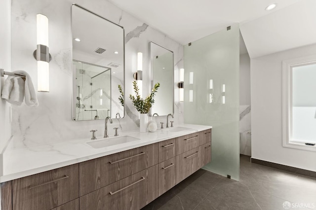 bathroom featuring walk in shower, vanity, and tile patterned floors