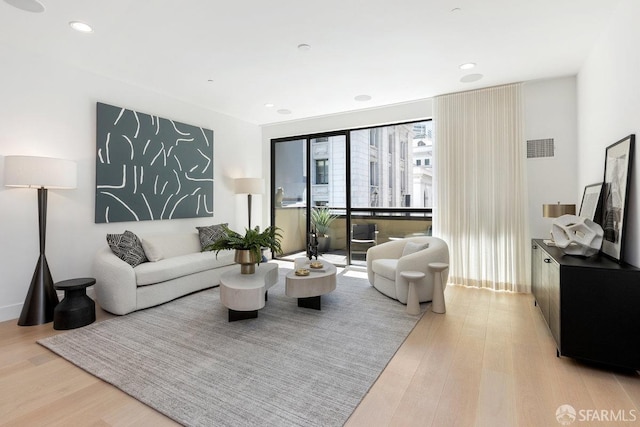 living room with light hardwood / wood-style floors