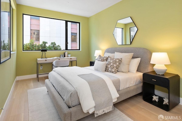 bedroom with light wood-type flooring