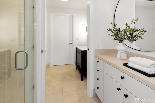 bathroom with an enclosed shower and vanity