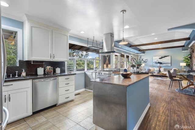 kitchen featuring stainless steel appliances, white cabinetry, island exhaust hood, and pendant lighting