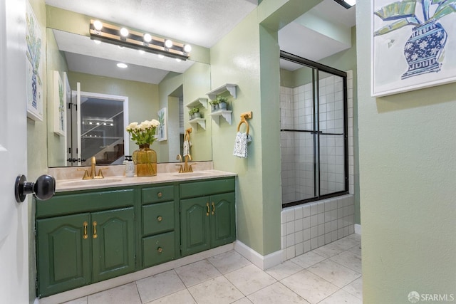 bathroom with walk in shower, tile patterned floors, and vanity