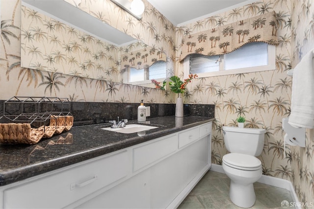 bathroom with vanity and toilet