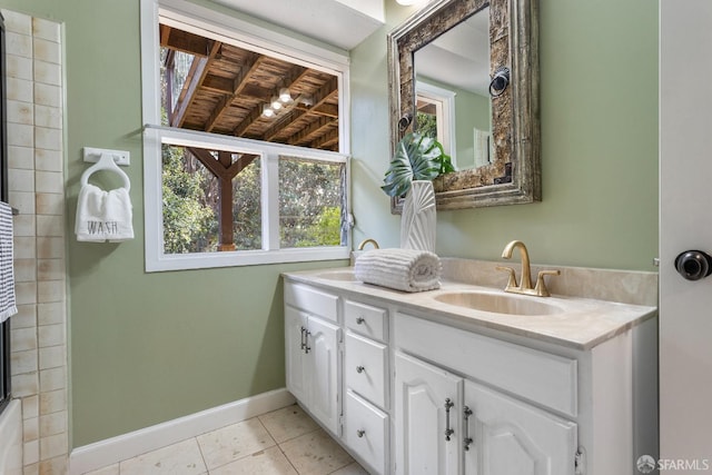 bathroom with tile patterned flooring and vanity