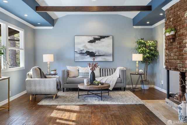 living room with ornamental molding, wood-type flooring, lofted ceiling with beams, and a brick fireplace