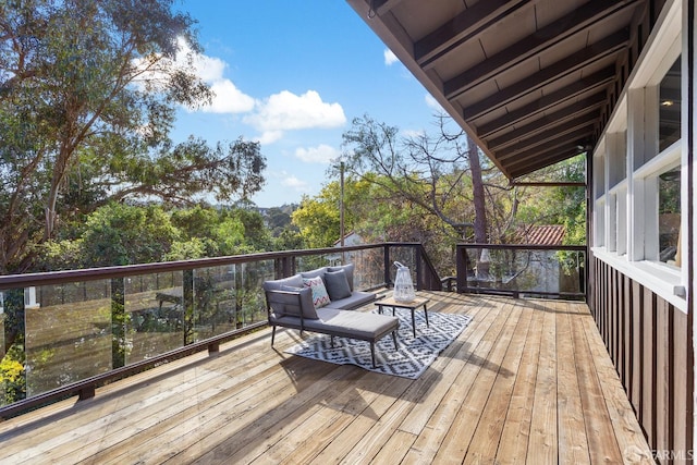 wooden terrace featuring an outdoor hangout area