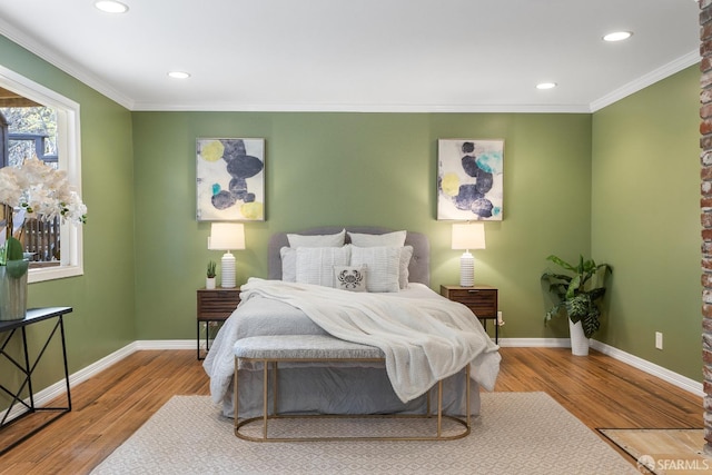 bedroom featuring hardwood / wood-style flooring and ornamental molding