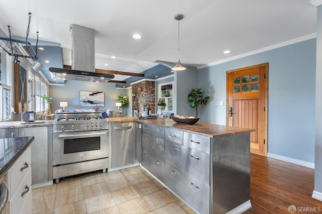 kitchen featuring appliances with stainless steel finishes, island range hood, decorative light fixtures, ornamental molding, and kitchen peninsula