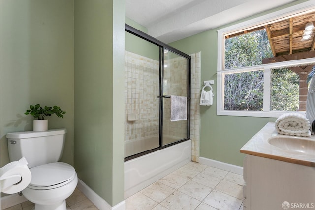 full bathroom featuring enclosed tub / shower combo, vanity, and toilet