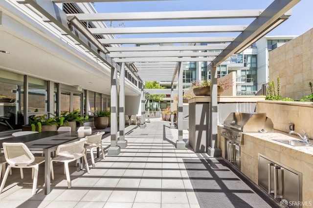420 Mission Bay Blvd Unit 708, San Francisco, CA 94158 - view of patio / terrace with a sink, outdoor dining area, area for grilling, a pergola, and an outdoor kitchen