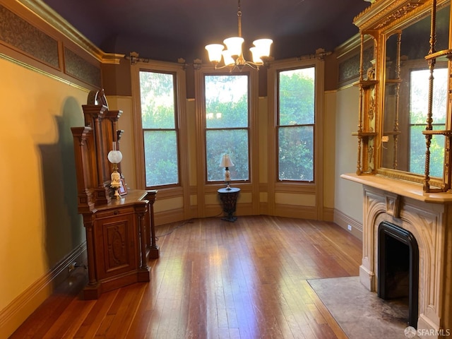 sitting room featuring a notable chandelier and dark hardwood / wood-style flooring