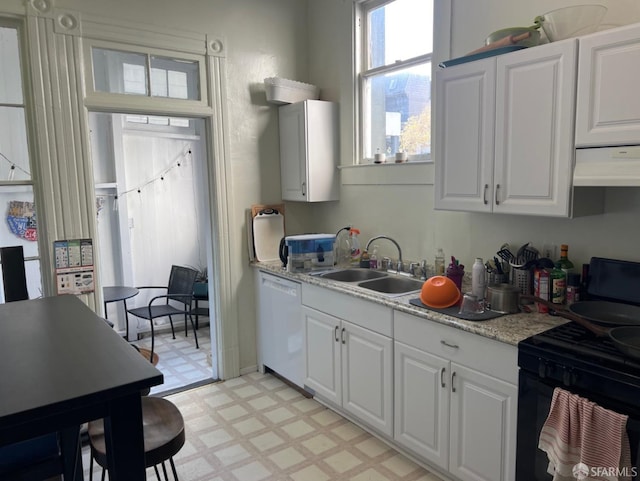 kitchen featuring white cabinetry, sink, electric range, and white dishwasher