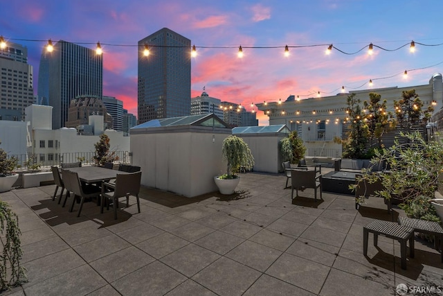 view of patio terrace at dusk