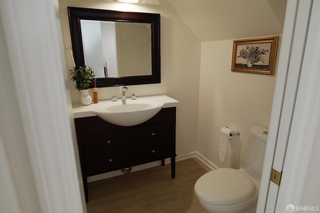 539 Pimlico Ct, Walnut Creek, CA 94597 - bathroom featuring vanity, wood finished floors, toilet, baseboards, and lofted ceiling