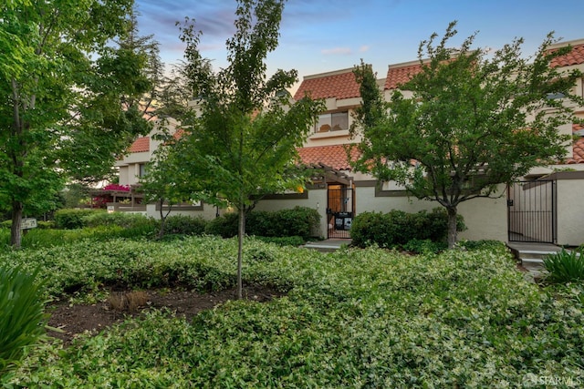 539 Pimlico Ct, Walnut Creek, CA 94597 - rear view of property featuring stucco siding, a tile roof, and a gate