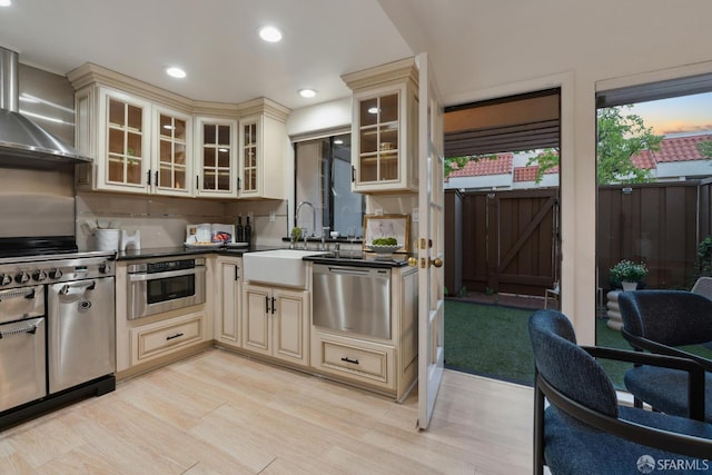 539 Pimlico Ct, Walnut Creek, CA 94597 - kitchen with cream cabinetry, a sink, stainless steel appliances, wall chimney exhaust hood, and recessed lighting