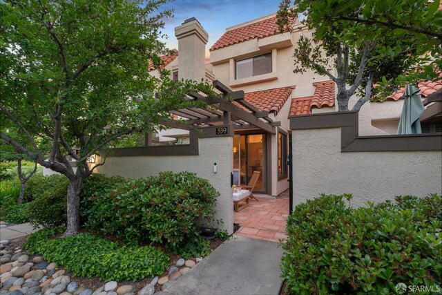 539 Pimlico Ct, Walnut Creek, CA 94597 - view of front of property with a tile roof, stucco siding, a pergola, and a patio area