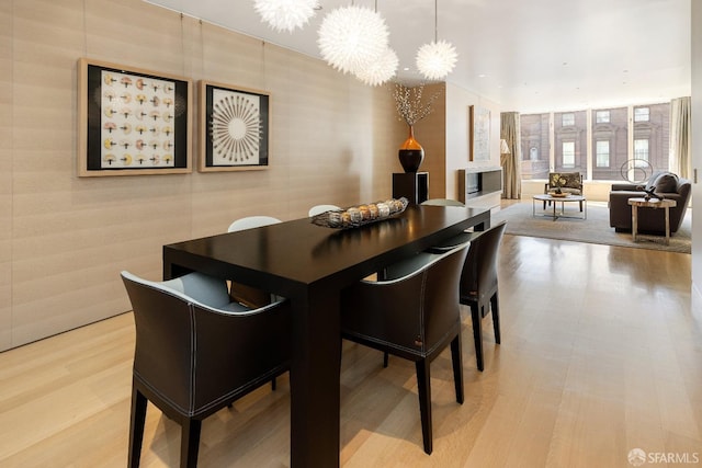 dining room featuring an inviting chandelier and light hardwood / wood-style floors