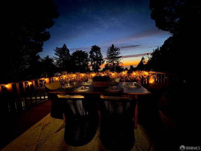 patio terrace at dusk with a fire pit