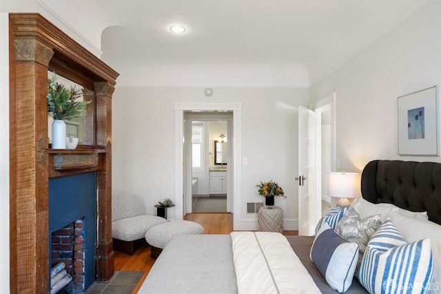 2864 Sacramento St, San Francisco, CA 94115 - bedroom featuring a large fireplace, wood finished floors, ensuite bath, and recessed lighting