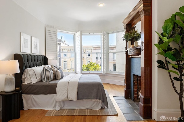 2864 Sacramento St, San Francisco, CA 94115 - bedroom featuring wood finished floors and a fireplace with flush hearth