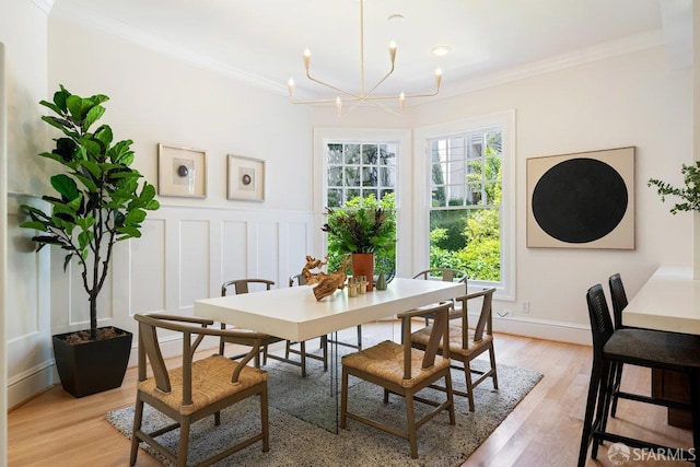 2864 Sacramento St, San Francisco, CA 94115 - dining space featuring a chandelier, ornamental molding, light wood-style flooring, a decorative wall, and a wainscoted wall