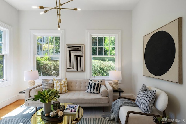 2864 Sacramento St, San Francisco, CA 94115 - living area with a chandelier, wood finished floors, and baseboards