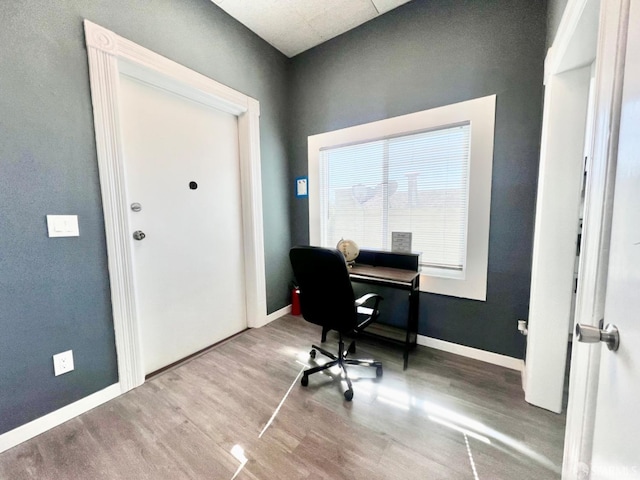 office space with wood-type flooring