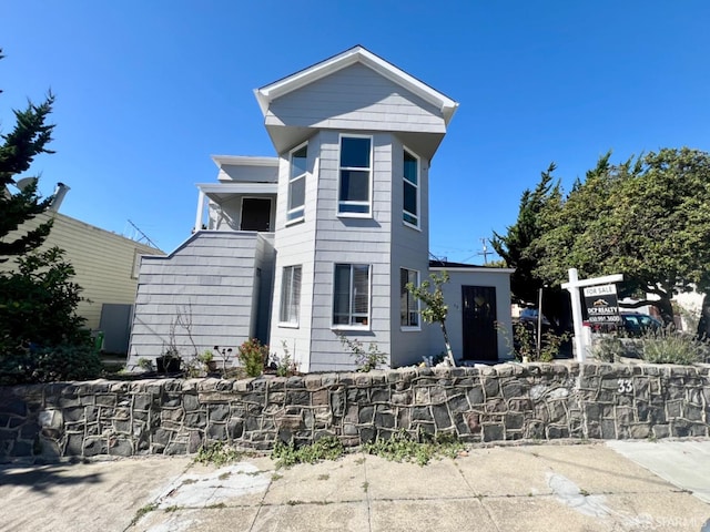 view of front of property with a balcony