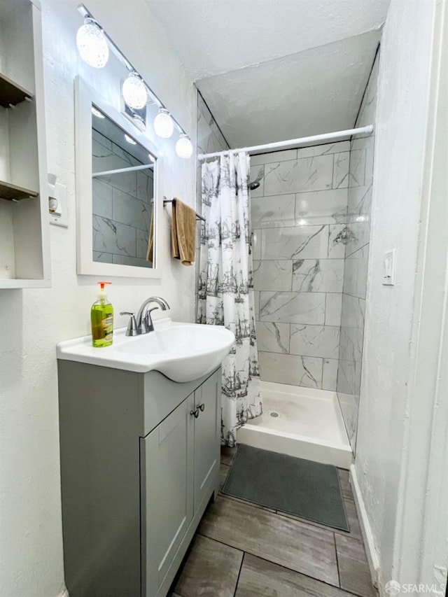 bathroom with vanity and walk in shower