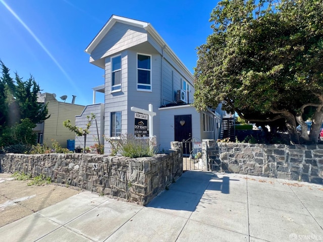 view of front of property featuring cooling unit