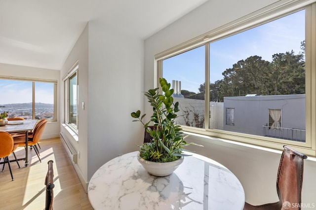 75 Roosevelt Way Unit 1, San Francisco, CA 94114 - dining space with a baseboard radiator, plenty of natural light, and light wood-style flooring