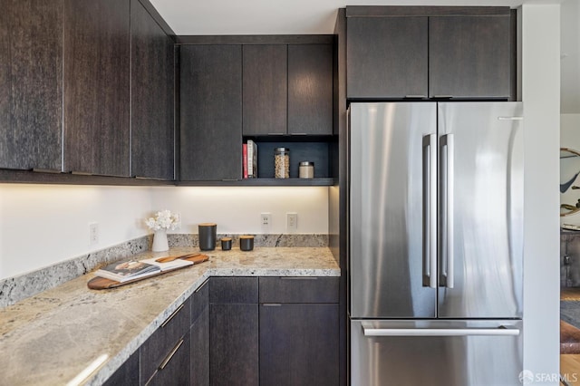 75 Roosevelt Way Unit 1, San Francisco, CA 94114 - kitchen featuring freestanding refrigerator, light countertops, dark brown cabinetry, and modern cabinets