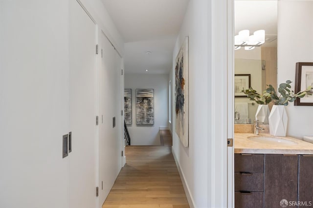 75 Roosevelt Way Unit 1, San Francisco, CA 94114 - corridor with a sink and light wood-type flooring