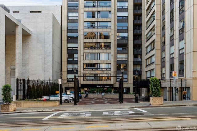 view of building exterior with fence