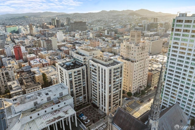 property's view of city with a mountain view