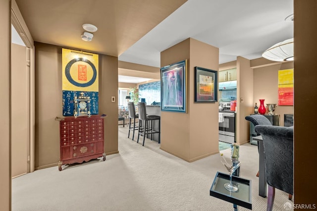 corridor featuring baseboards and carpet floors