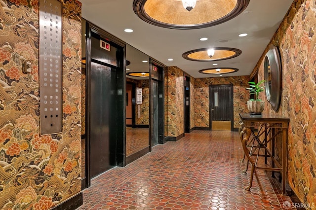 corridor with elevator and recessed lighting